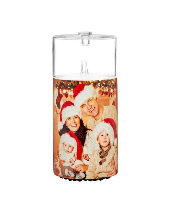 A christmas candle holder with a photo of a family in santa hats.