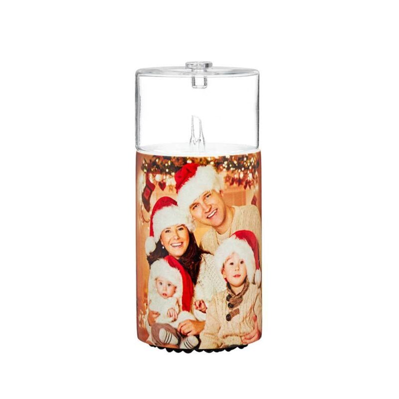 A christmas candle holder with a photo of a family in santa hats.