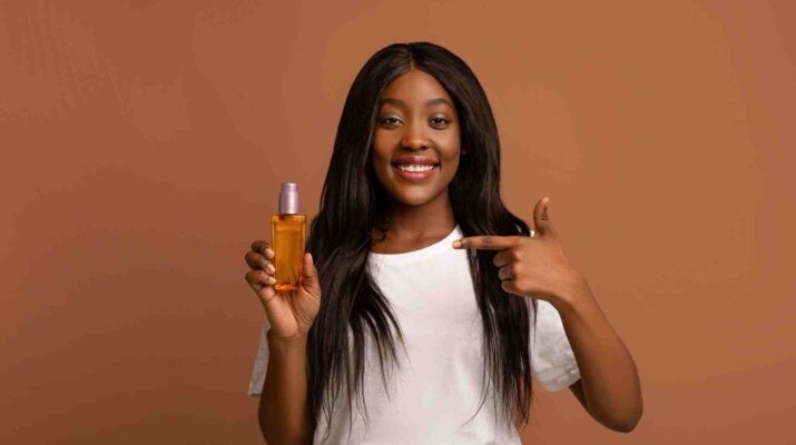 black woman with hair oil