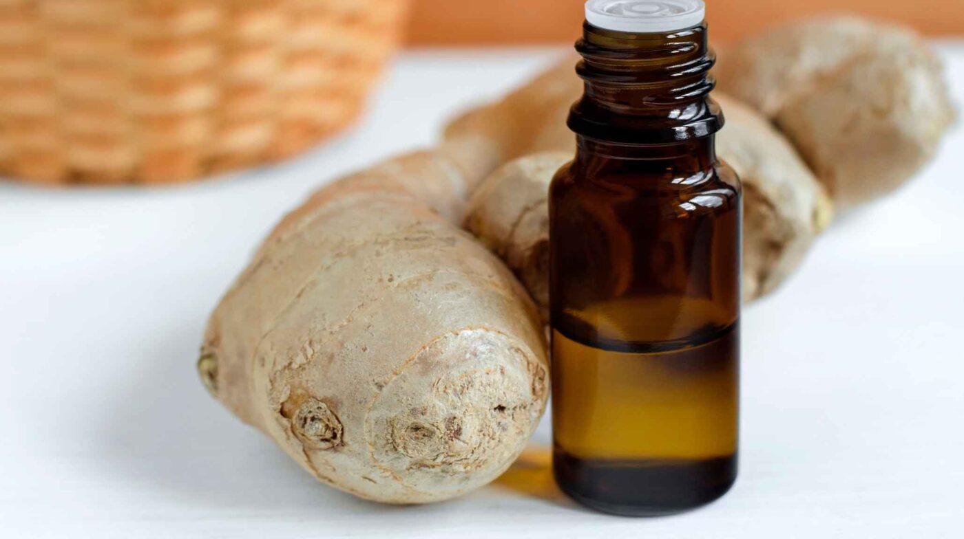 essential oil bottle and ginger
