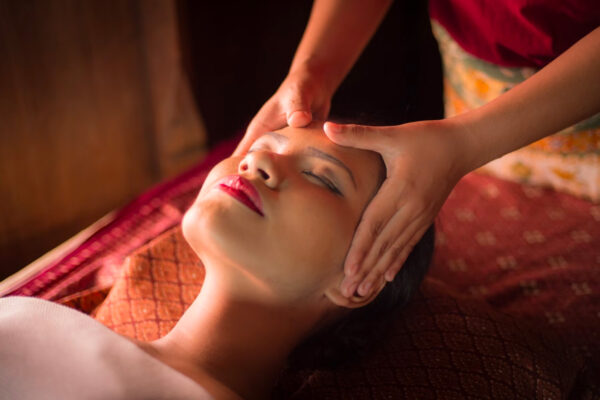 a woman getting a massage on her face