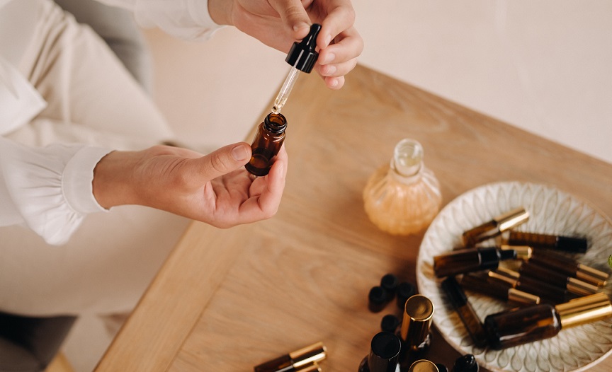 woman blending essential oils