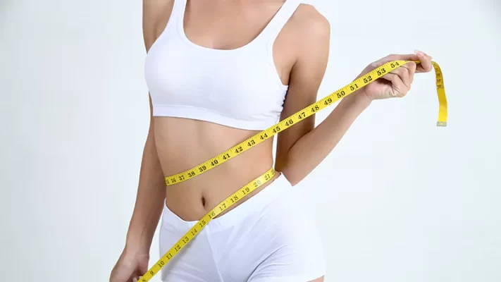 photo of a young woman with beautiful body measurement tape