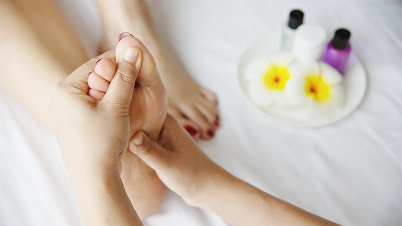 Photo of a woman's Feet getting a massage