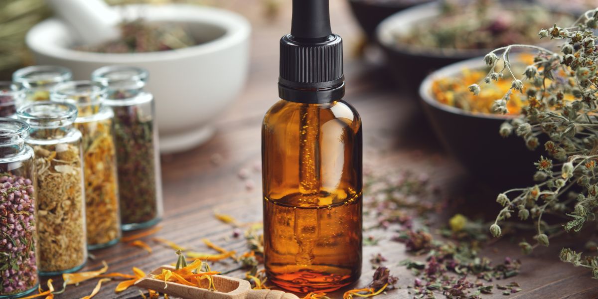  Antimicrobial Power of Essential oils and herbs on a wooden table.