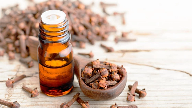 photo of clove oil on the to of table
