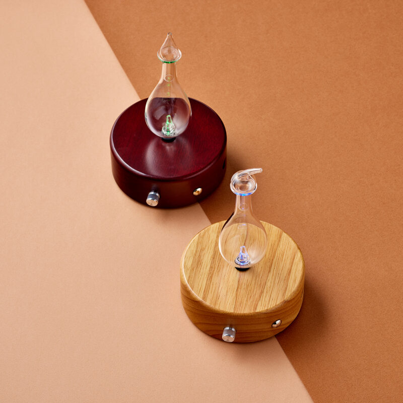 Tranquility Light and Dark with brown background tranquility rechargeable nebulizing diffuser both colors on display