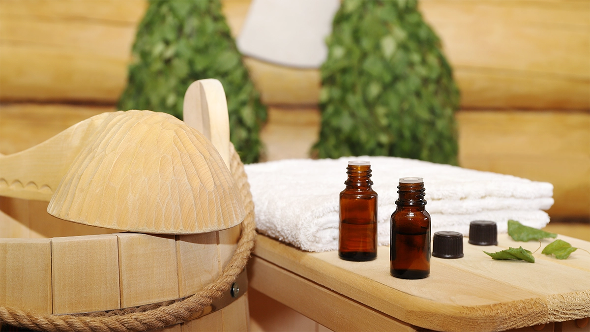 Various essential oil bottles and sauna accessories