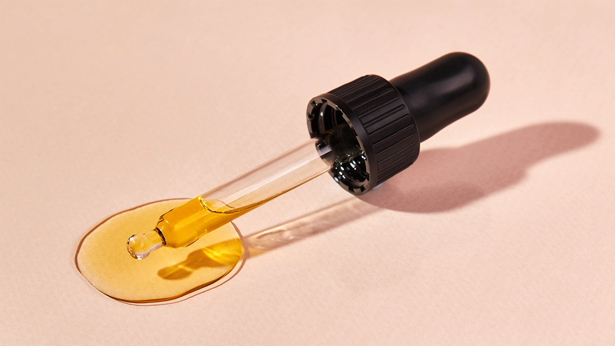 Dropper with yellow oil, highlighting fragrance oil safety and proper use