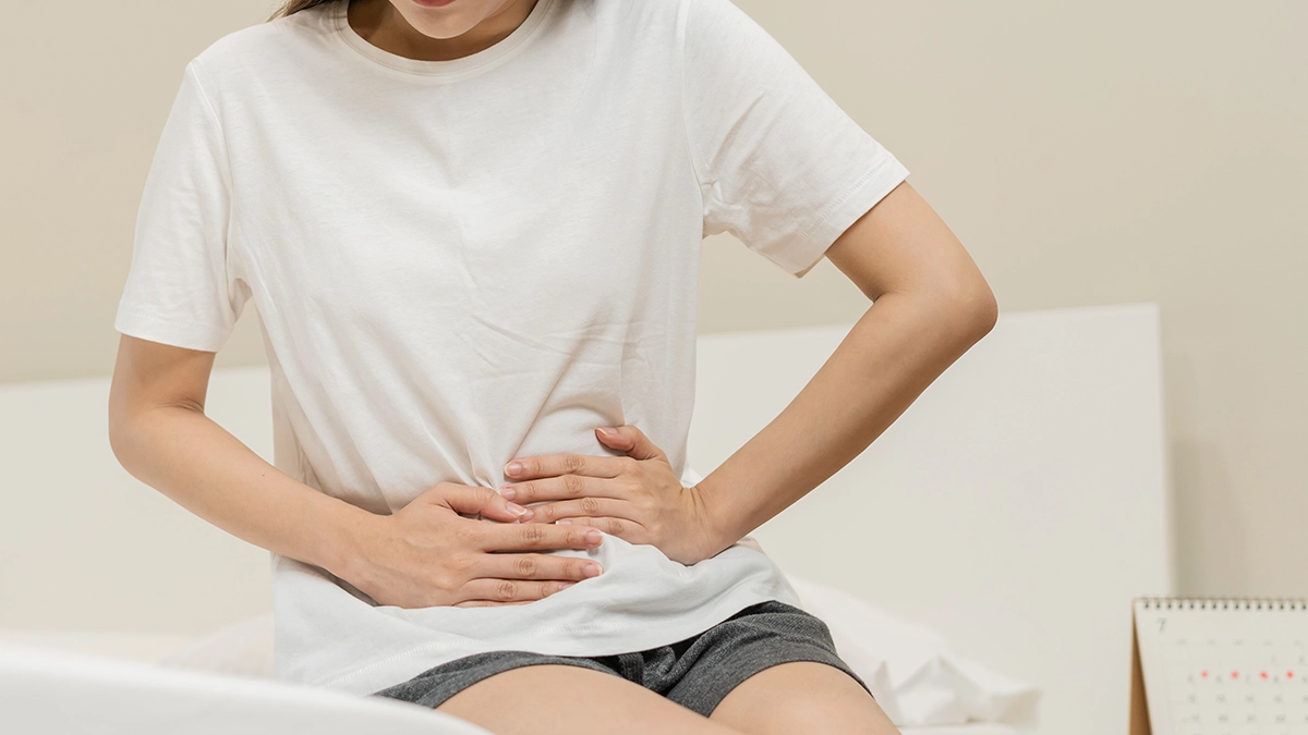 A woman with abdominal discomfort; essential oils may ease constipation