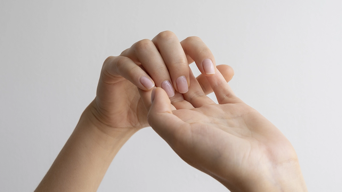 Hands with natural nails, illustrating gentle care for ingrown fingernails