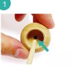 step 1 insert wooden stick into base of wooden ball