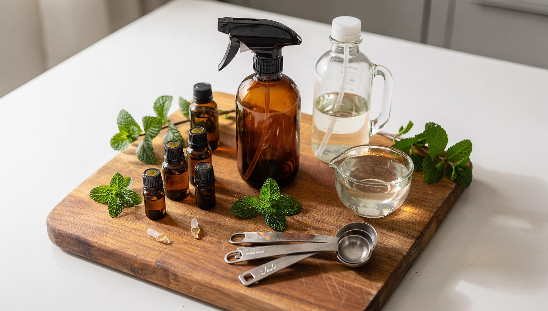 DIY spider repellent spray ingredients with essential oils and spray bottle