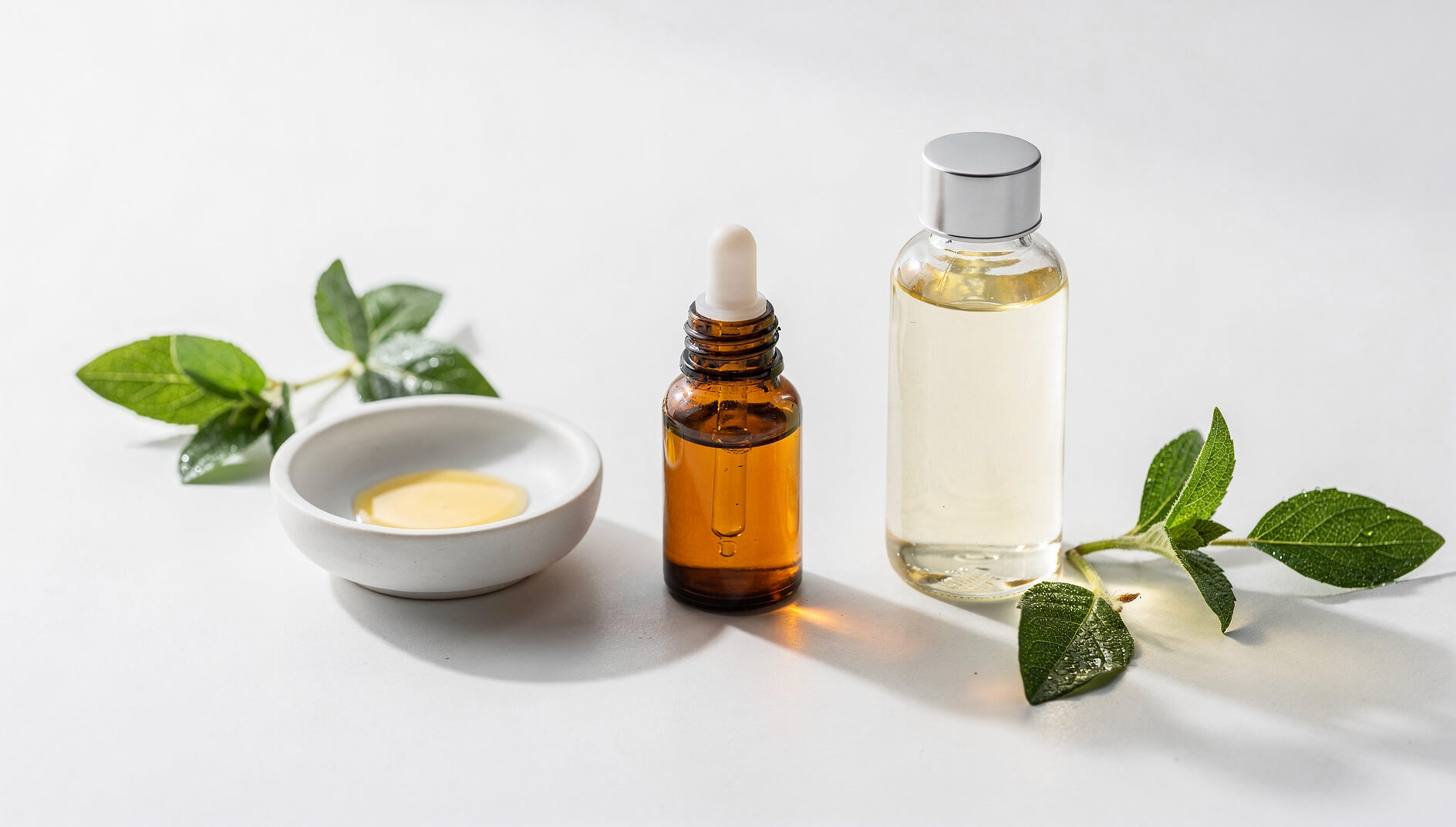 Essential oil safety and dilution setup with dropper bottles and carrier oil