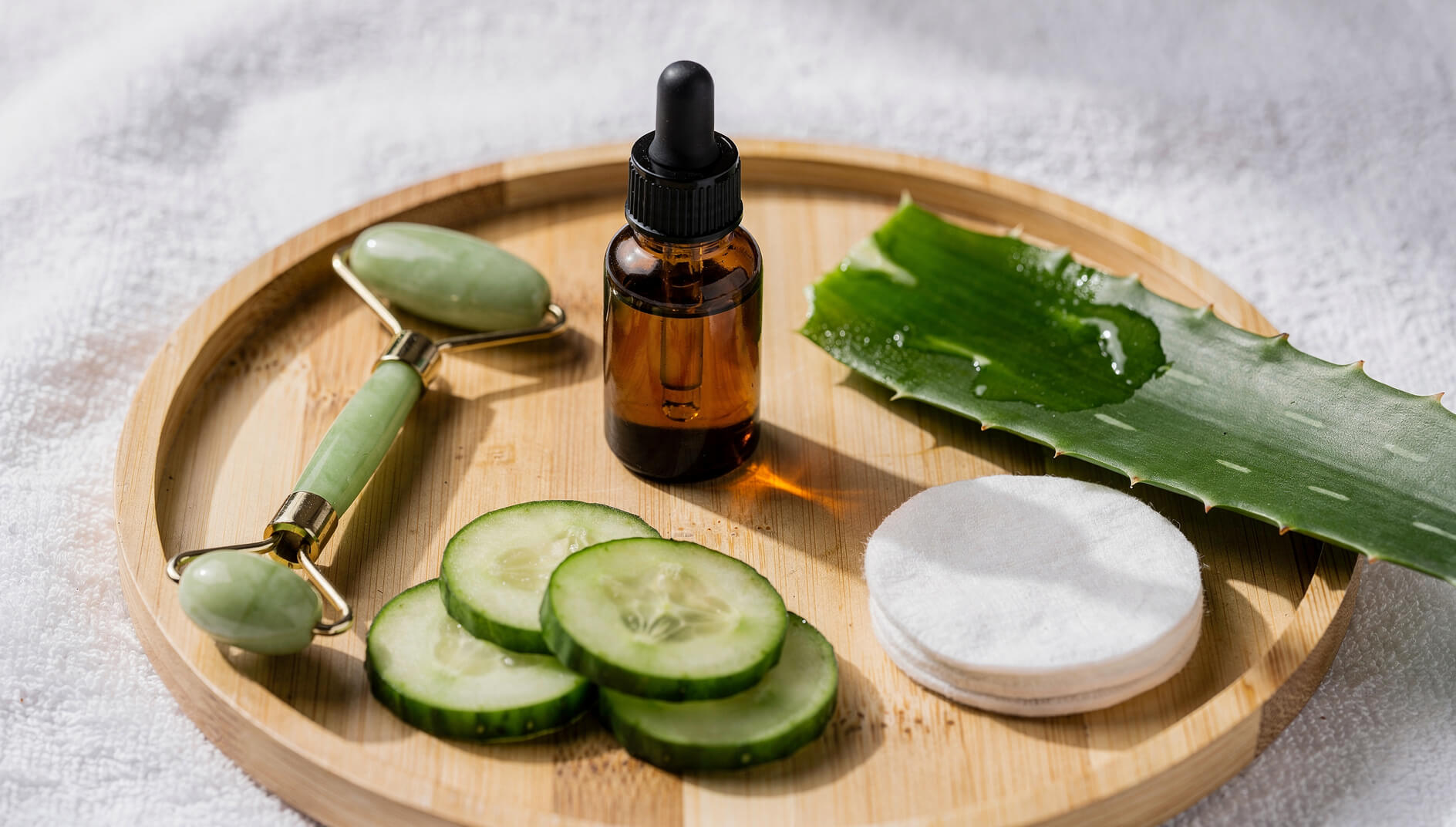Natural skincare scene with essential oil dropper and fresh botanicals